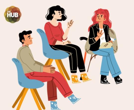 a group of people in dialogue